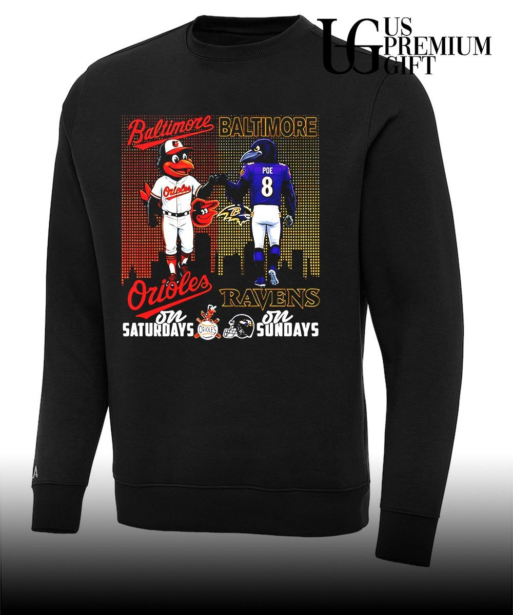 Baltimore Orioles on Saturdays fist bump Baltimore Ravens on Sundays city skyline 2026 mascot shirt