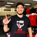 Carolina Hurricanes 2026 Stanley Cup Champs mascot raising trophy shirt