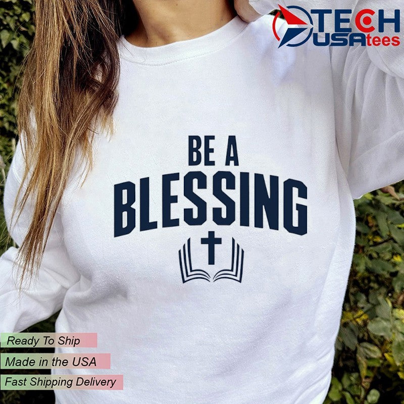 Drake Maye wearing be a blessing cross shirt