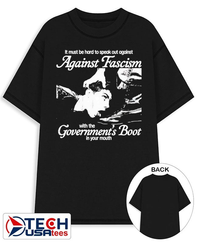 It must be hard to speak out against against fascism with the Government’s Boot in your mouth shirt