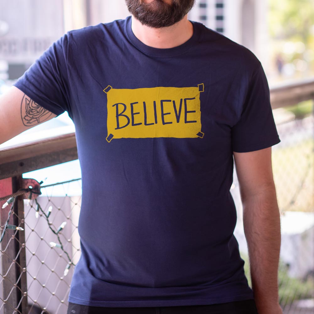 Believe Taped Yellow Paper Sign