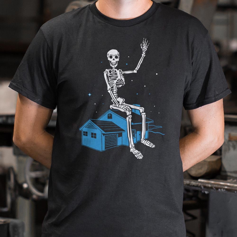 Giant Skeleton Waving from Rooftop of a House