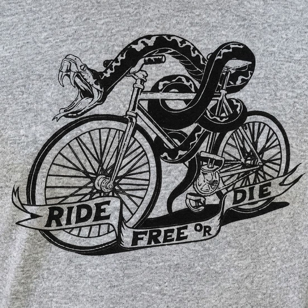 Ride Free or Die Tattoo Style Snake Riding a Bicycle